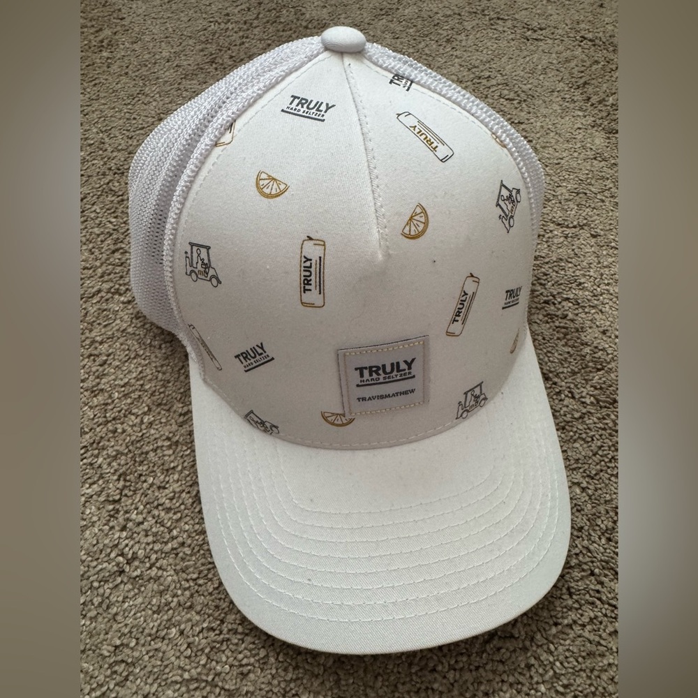 TRAVIS MATHEW GOLF Truly White and Tan Trucker Hat.